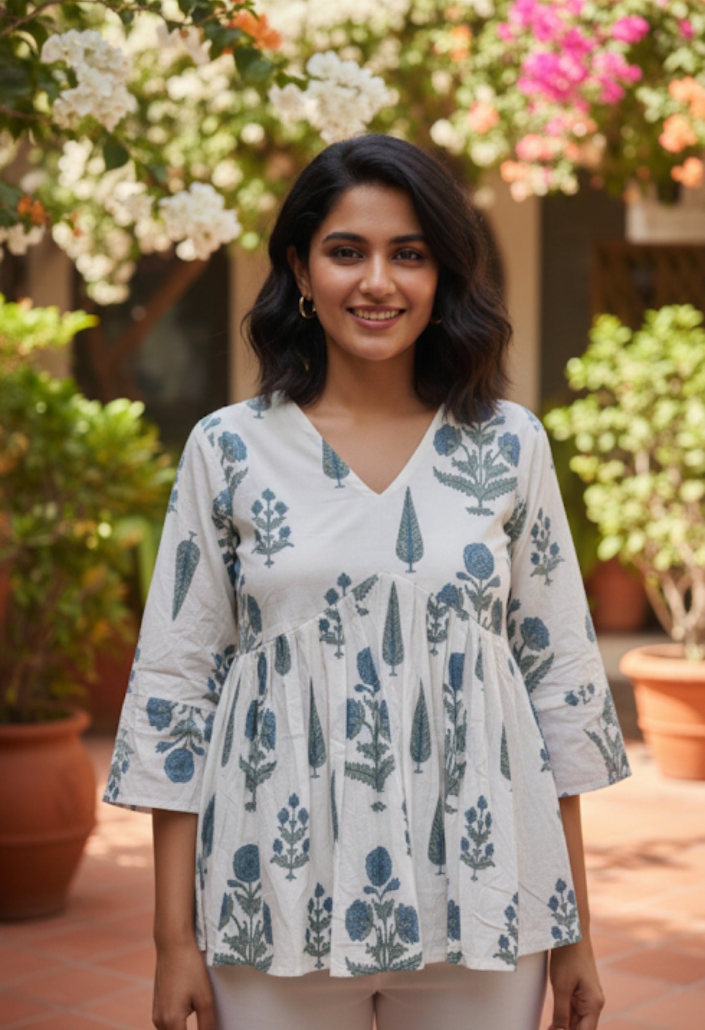 The Artisanal Indigo Bloom Peplum Top